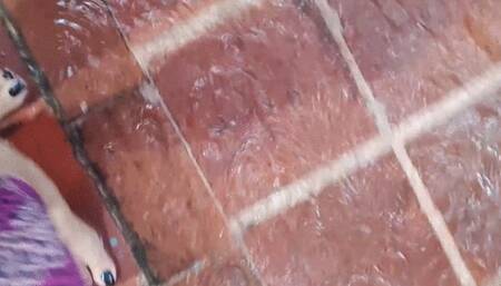 Angelin's beautiful feet playing with water in the rain (1)
