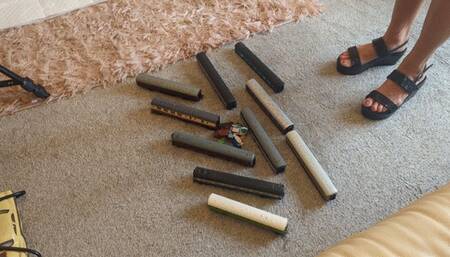 GIANTESS Charn crushes 10 toy model train coaches in black wedges extra high right view