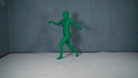 Green man in zentai in transparent vacuum bed with flips and vibration