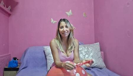 Blow to pop red punchball and rub another punchball