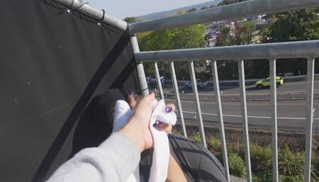PainfulPleasure Smothers Her Best Friend With Her Stinky Feet Then Gives Him A FootJob On Balcony For Everyone to see