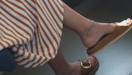 Beauty feet slipper dangling, wrinkled foot fetish close-up
