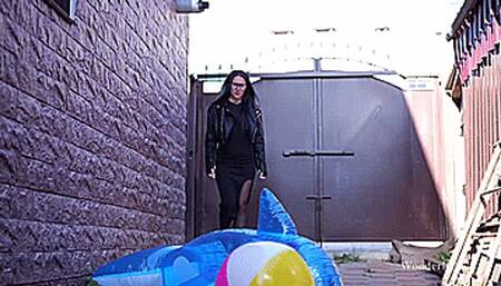 Strict business lady and inflatables toys