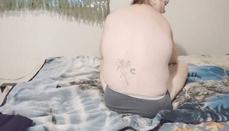 Tempest doing warm up stretches on bed