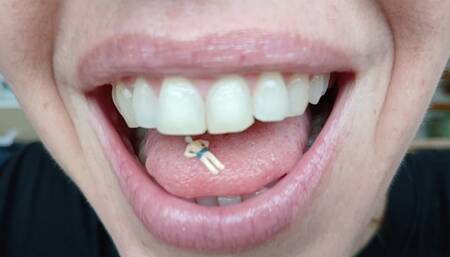 Lania finds a tiny soldier and shrinks him slowly so she can play with him inside her mouth