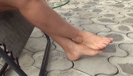 rubs feet crossed at the ankles 18FF