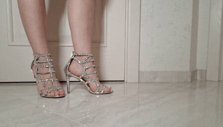 Hostess sore feet in silver strappy sandals F