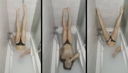 Natasha holds her breath while standing upside down