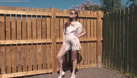 Honour May wets her panties in the garden