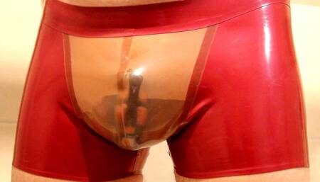 Pissing in Latex Shorts While in Chastity