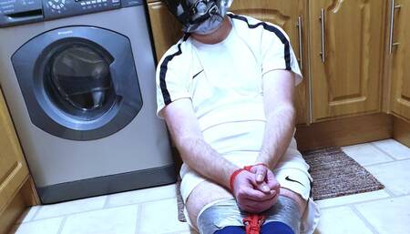 Footballer duct taped on kitchen floor 1