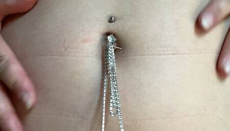 girl with piercing inflates circle and dolphin