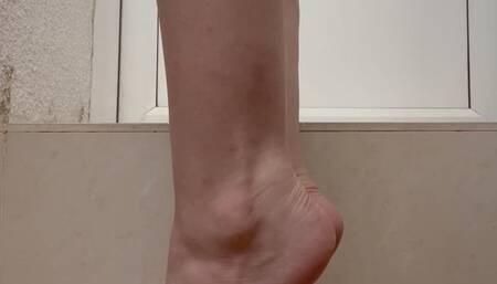 Bare feet with red toenails polish