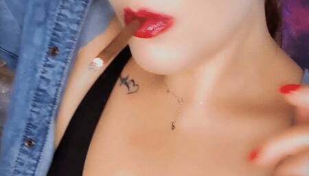 There's a seductive confidence in the way I move, the flicker of the cigarette between my fingers