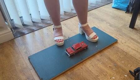 Giantess Lou crushes a 1957 Chey bel air in white chucky heels high left view