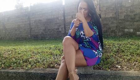 Beautiful woman in the park crossing her legs while smoking cigarettes (3)