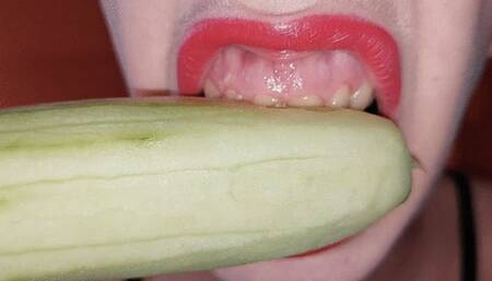 chewing and eating a cucumber