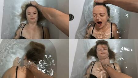 The guy holds Anastasia underwater