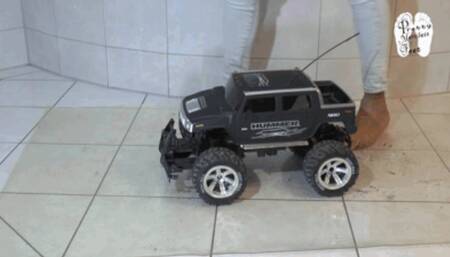 Big Car under pretty naked feet