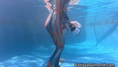 Carissa in her new pool using the underwater scooter