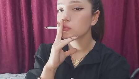 SMOKING MARLY BLOWING SMOKE INTO THE CAMERA