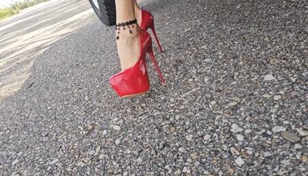 Katherine driving a classic Toyota Land Cruiser 1977 on sexy red platform heels