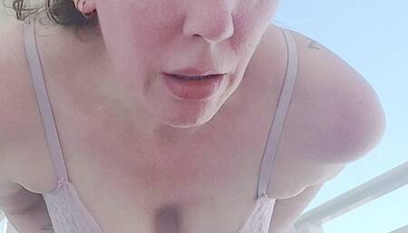Stevie wears her sheer lingerie on the balcony, sneezing in the fresh air