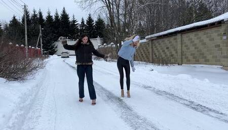 Two girl on high heels mules walking on ice, slippery high heels, girl on high heels on ice