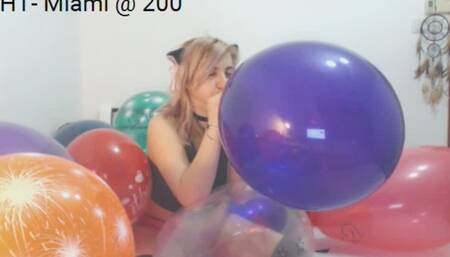 Blow to Pop Surrounded by Balloons