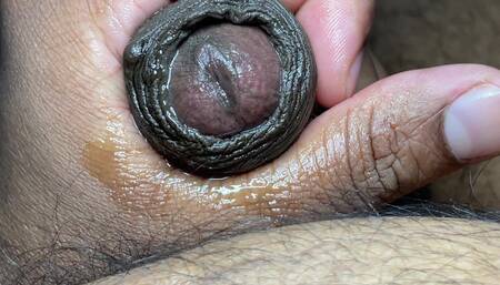 Guy Masturbating by Rubbing the Head of the Dick and Fingering It Like a Pussy