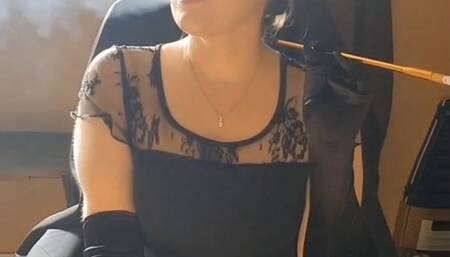 Faith smoking with cigarette holder and opera gloves