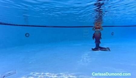 Carissa as a Mermaid in the pool at the resort