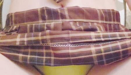 Wetting incontinence pad in school uniform