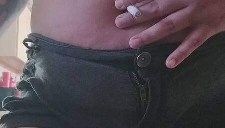 Smoking and drinking with small shirt and belly out