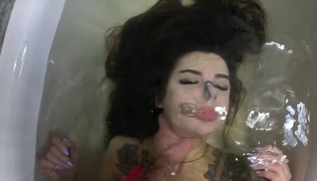 Dunking a sexy long-haired brunette underwater