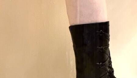 Close up of my black leather boots getting wet in the shower
