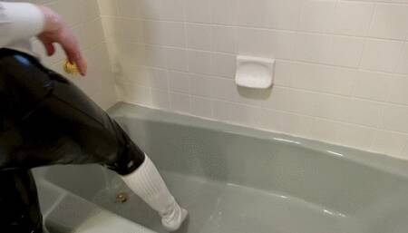 Taking off my shirt and tie while all soaked in the bathtub