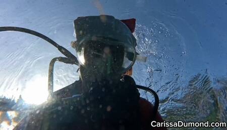 Carissa in the red cat suit scuba diving in the spring