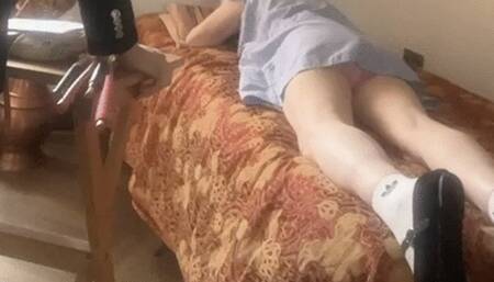 The sissy on the bed