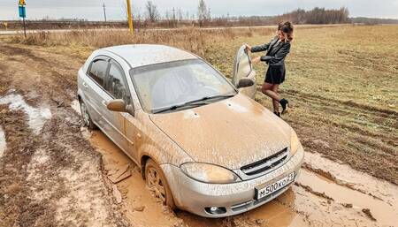 CAR STUCK Realtor Tanya is stuck in the mud