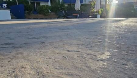 Milah Arches walking around the pool on sexy flip flops