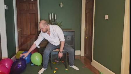 Tom bursts over 100 party balloons