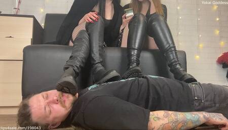 My friend and I using My slave as a footrest under our boots