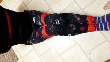 All tied up in pyjmas on the kitchen floor