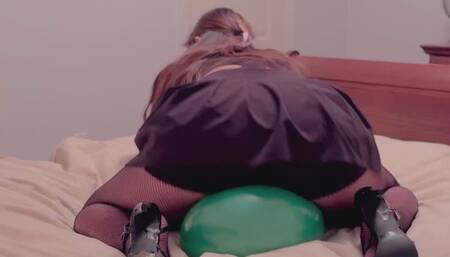 Asian cutie pops a balloon using her heels