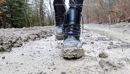 Very dirty Dr Martens boots walking in mud