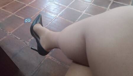My stiletto heels dangle from my feet while I wear pantyhose stockings (1)