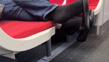 Shoeplay fun on the train wearing ballet flats and socks