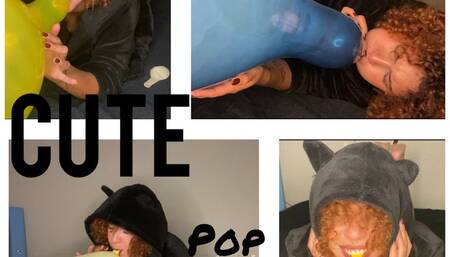 Playful kitten with balloons