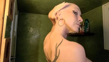 Shaving Her Own Head Down to the Skin